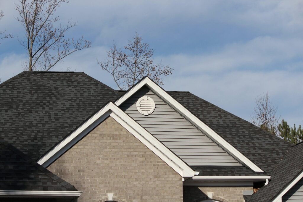 Certified local roofing contractors replacing architectural shingles on a residential home in Anderson, Indiana.